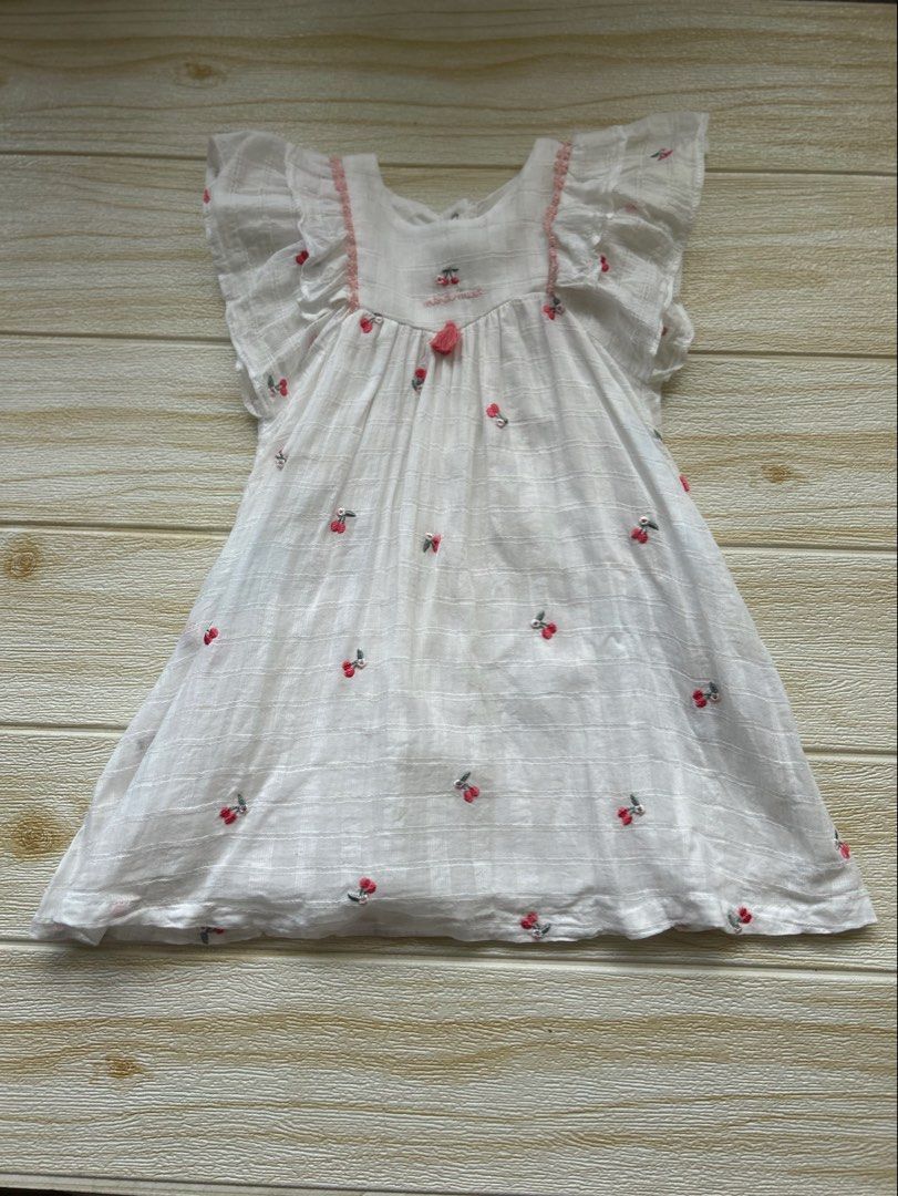 Minkmui Summer dress (Category: Babies & Kids Fashion) located in Cebu City. Submitted by yjainani (Listing ID 1466670554, Image 1). Description: white toddler girl's summer dress featuring small embroidered red cherries and flutter sleeves.