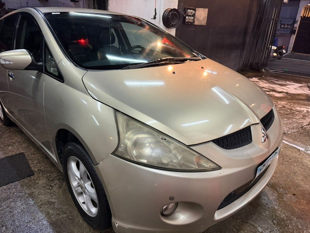 Mitsubishi Grandis 2.4 MIVEC G (A) (Category: Used Cars) located in Pasig City. Submitted by qwerty1026 (Listing ID 1466643433, Image 2). Description: 2011 Mitsubishi Grandis automatic gasoline, 7-seater MPV in champagne gold. Good daily driver with no mechanical issues; engine and transmission are running smooth ✅ 2011 model, 132,991 km mileage, Automatic transmission ✅ No mechanical issues, solid daily driver for family use ✅ Aftermarket touchs