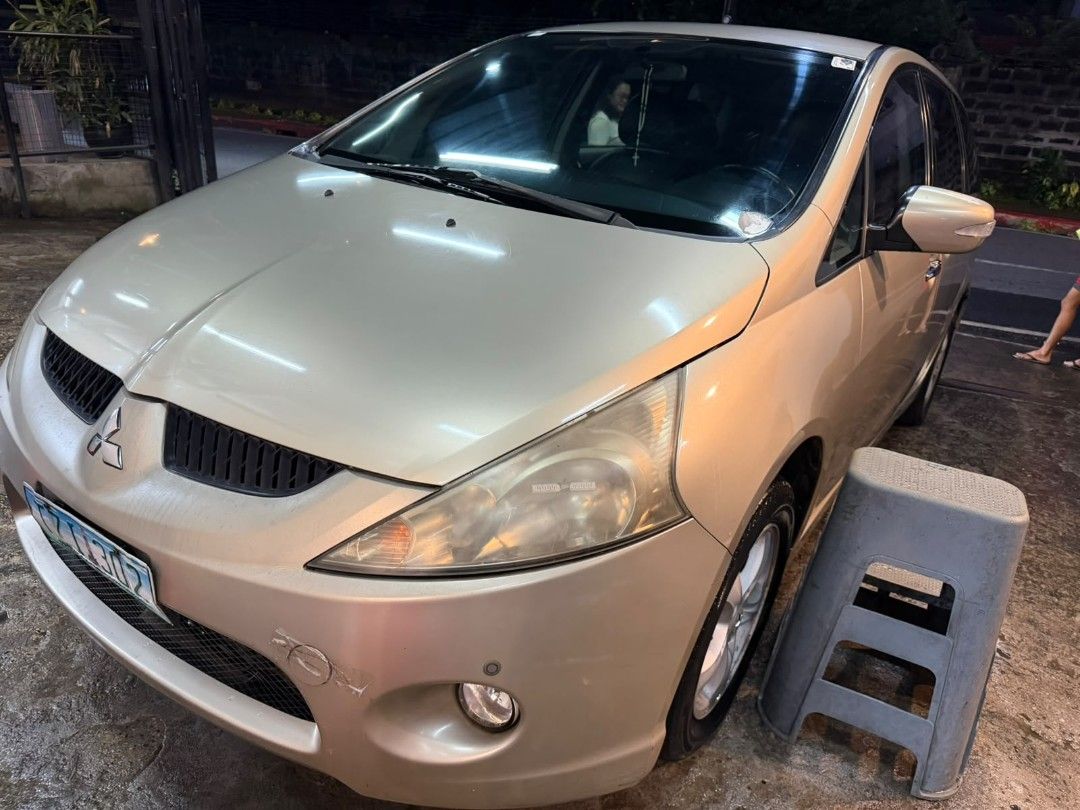 Mitsubishi Grandis 2.4 MIVEC G (A) (Category: Used Cars) located in Pasig City. Submitted by qwerty1026 (Listing ID 1466643433, Image 3). Description: 2011 Mitsubishi Grandis automatic gasoline, 7-seater MPV in champagne gold. Good daily driver with no mechanical issues; engine and transmission are running smooth ✅ 2011 model, 132,991 km mileage, Automatic transmission ✅ No mechanical issues, solid daily driver for family use ✅ Aftermarket touchs