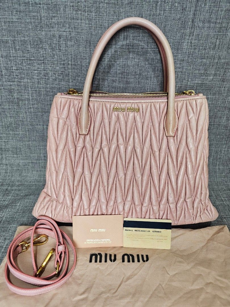 Miu Miu (Category: Luxury Bags & Wallets) located in Bontoc. Submitted by athena_zia (Listing ID 1466711153, Image 2). Description: 💕 MIU MIU MATELASSÉ TWO-WAY BAG IN GERANIO 💕 Your ultimate soft girl bag is here! ✓ Color: Geranio - rare light nude pink ✓ Style: Matelassé leather, 2-way (Top handle + Sling) ✓ Inclusion: COMPLETE with Authenticity Card + Dust Bag ✓ Condition: With normal signs of wear - handles with light rubs, leather still puf