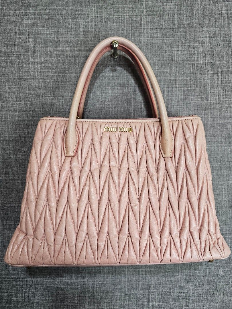 Miu Miu (Category: Luxury Bags & Wallets) located in Bontoc. Submitted by athena_zia (Listing ID 1466711153, Image 3). Description: 💕 MIU MIU MATELASSÉ TWO-WAY BAG IN GERANIO 💕 Your ultimate soft girl bag is here! ✓ Color: Geranio - rare light nude pink ✓ Style: Matelassé leather, 2-way (Top handle + Sling) ✓ Inclusion: COMPLETE with Authenticity Card + Dust Bag ✓ Condition: With normal signs of wear - handles with light rubs, leather still puf