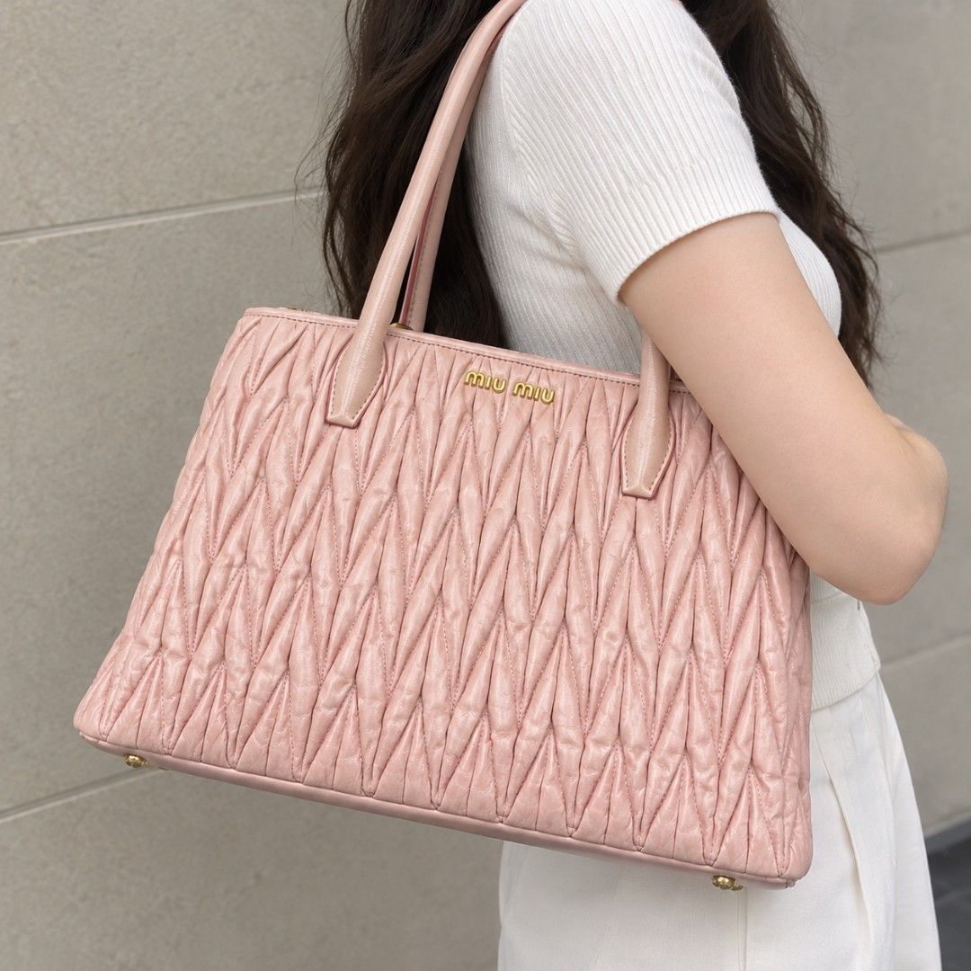 Miu Miu (Category: Luxury Bags & Wallets) located in Bontoc. Submitted by athena_zia (Listing ID 1466711153, Image 1). Description: 💕 MIU MIU MATELASSÉ TWO-WAY BAG IN GERANIO 💕 Your ultimate soft girl bag is here! ✓ Color: Geranio - rare light nude pink ✓ Style: Matelassé leather, 2-way (Top handle + Sling) ✓ Inclusion: COMPLETE with Authenticity Card + Dust Bag ✓ Condition: With normal signs of wear - handles with light rubs, leather still puf