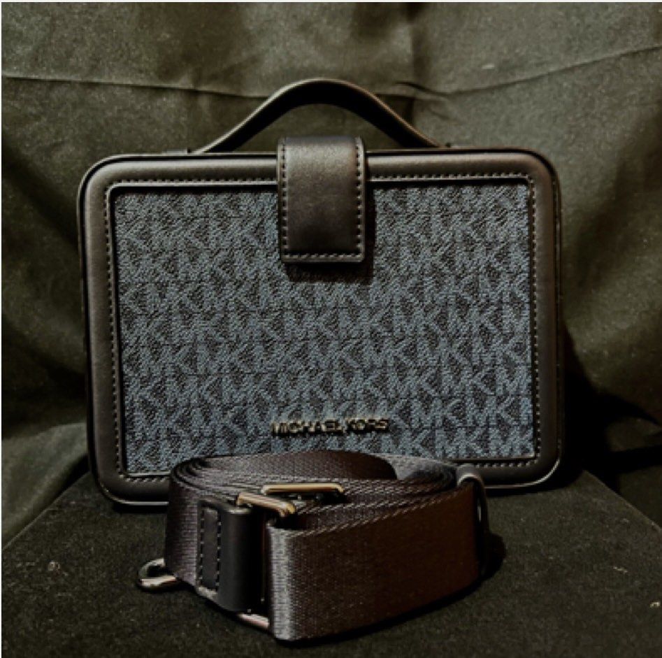 MK Cooper Black Sling Bag (Category: Sling Bags) located in Marikina City. Submitted by sakura_07 (Listing ID 1466640509, Image 1). Description: - Authentic Michael Kors Cooper Black Sling Bag - Features iconic MK monogram pattern on durable canvas - Structured boxy design with a convenient top handle and adjustable shoulder strap - Interior includes handy card slots and Michael Kors metal logo plaque - Clean lining with repeating monogram print 