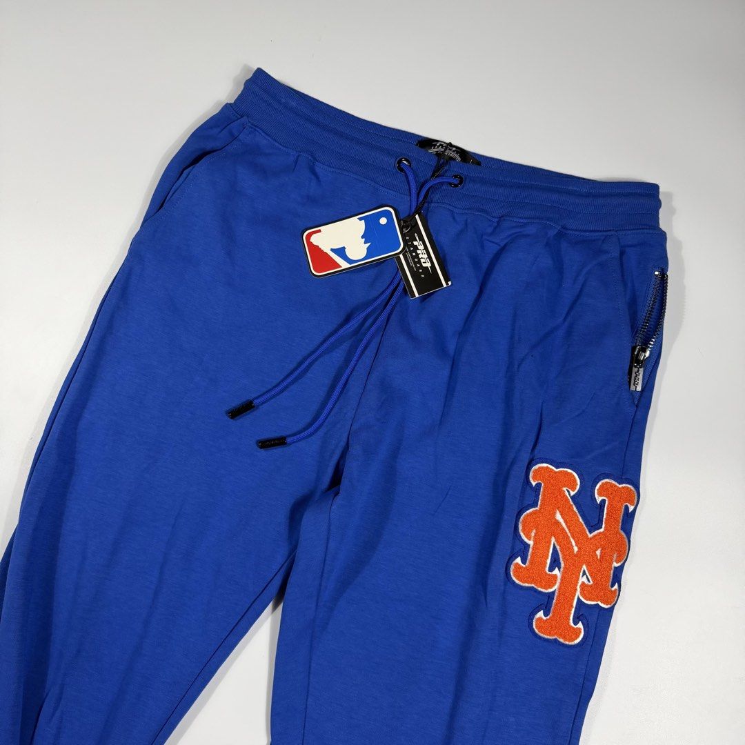 MLB Pro Standard New York Mets Sweatpants (Category: Joggers) located in Bacolod City. Submitted by freshstuff13 (Listing ID 1466717619, Image 3). Description: - Brand: Pro Standard (Officially Licensed MLB merchandise) - Team: New York Mets - Color: Royal Blue - Size: XL - Condition: Brand new with original MLB and Pro Standard tags attached - Design: Eye-catching orange and white chenille team logo patches on left thigh and right lower leg, plu