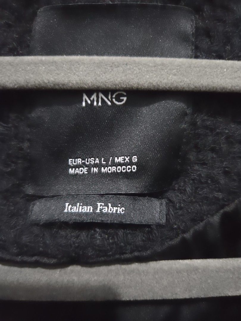 MNG Black Textured Button-Up Jacket Size L (Category: Coats, Jackets and Outerwear) located in Quezon City. Submitted by sashasarisarishoppe (Listing ID 1466667648, Image 3). Description: - Brand: MNG - Material: Premium Italian fabric with a textured fleece-like feel - Size: L (US/MEX L) - Origin: Made in Morocco - Closure: Button-up front with metallic round buttons - Pockets: Four front pockets with flaps - Style: Long sleeves, versatile and c