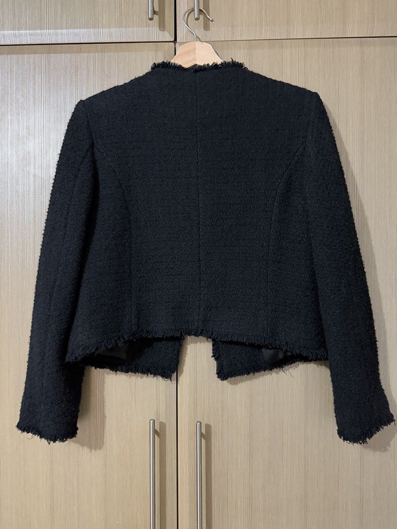 MNG Black Tweed Jacket Size S (Category: Coats, Jackets and Outerwear) located in Taguig. Submitted by mengxir20193848 (Listing ID 1466672689, Image 3). Description: - Brand: MNG - Size: S (Made in Morocco) - Material: Textured black tweed with fully lined interior - Details: Gold embossed buttons, 4 front patch pockets, frayed edges - Fit: Classic cropped cut - Style: Smart outerwear, perfect for elevating any outfit.