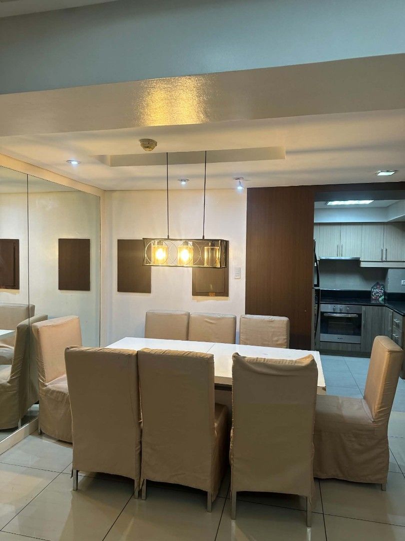 Modern dining table and 6 upholstered chairs set (Category: Apartments & Condos) located in Pateros City. Submitted by ragamat13 (Listing ID 1466593793, Image 1). Description: - Complete Dining Set: Includes a bright white top table and 6 chairs with full beige fabric slipcovers - Includes Lighting: Comes with a modern industrial 3-bulb pendant light - Versatile Style: Clean lines and neutral colors that easily match various interior designs - Du