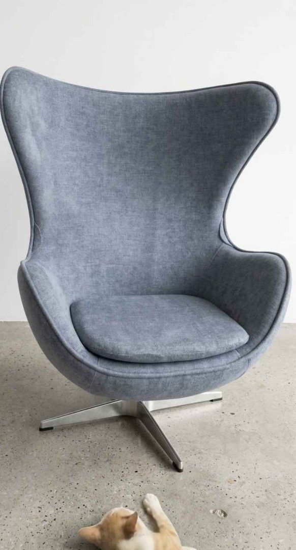 Modern Grey Egg Chair with Ottoman (Category: Chairs) located in Manila. Submitted by casjessic81050 (Listing ID 1466574503, Image 1). Description: - Colour & Material: Soft heather grey textured fabric upholstery - Design: Modern egg chair shape with deep, wrap-around seating - Base: Durable four-pronged brushed metal star base - Functionality: Smooth swivel rotation mechanism on both chair and matching footstool - Ideal For: Living rooms, bedro