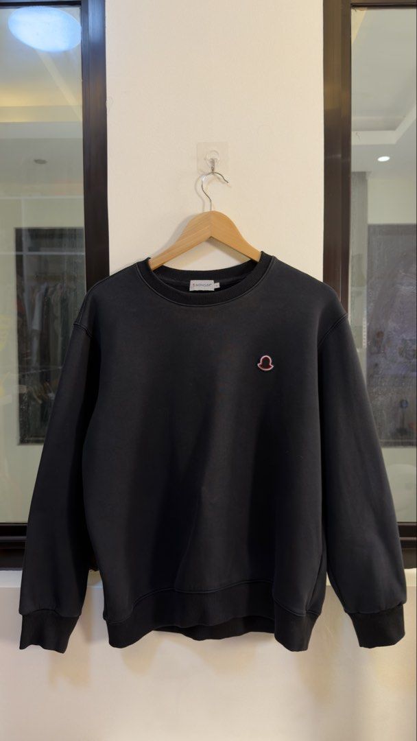 Moncler Black Sweatshirt Unique Fabric Material (Category: Coats, Jackets and Outerwear) located in Paranaque City. Submitted by preluxeshop_ph (Listing ID 1466766528, Image 2). Description: Moncler Black Sweatshirt Unique Fabric Material -Features: Iconic Moncler logo on chest -Condition: 9.8/10 -Dimes: Length: 24” Width: 22.5”.