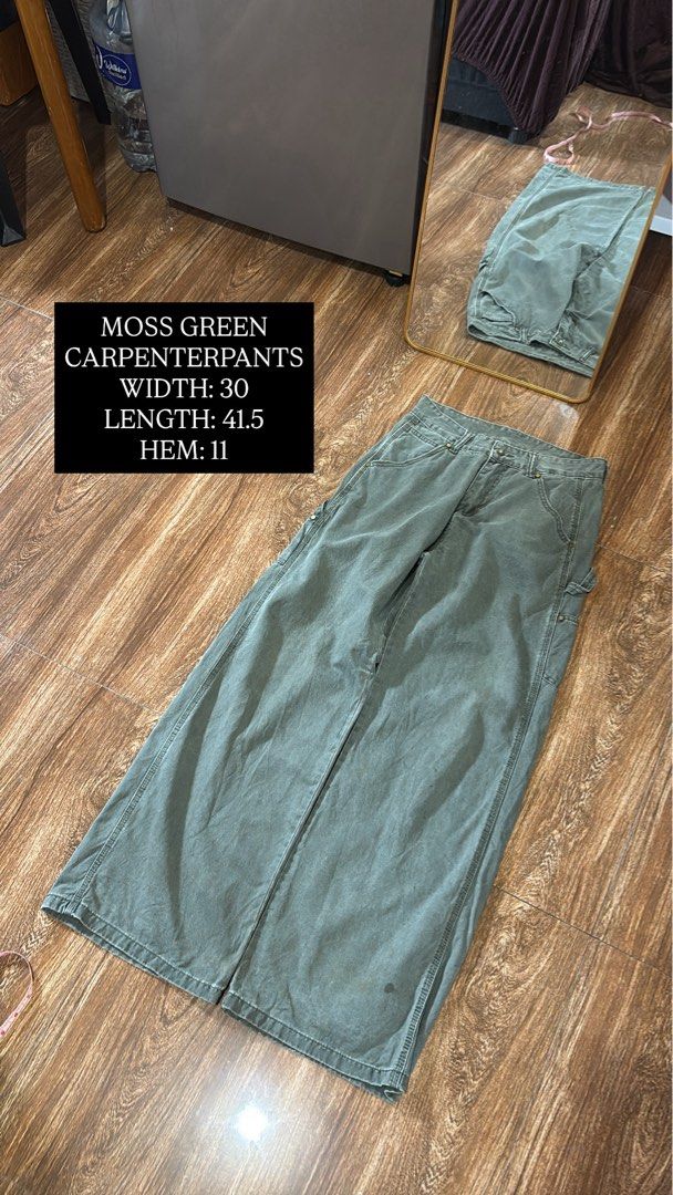 Moss Green Carpenter Pants Size 30 (Category: Jeans) located in Batangas. Submitted by franzbucal (Listing ID 1466609117, Image 1). Description: - Color: Moss green - Style: Workwear carpenter pants with utility pockets and hammer loop - Fit: Relaxed, wide-leg - Material: Sturdy denim-like fabric with visible wear from past use - Measurements: Width 30, Length 41.5, Hem 11.