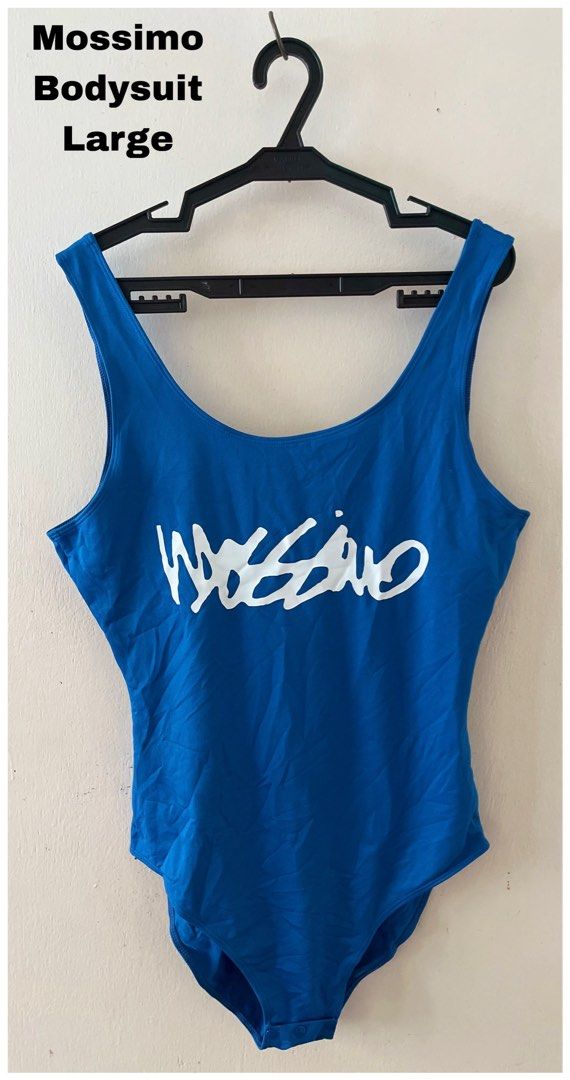Mossimo Blue Bodysuit Size 12 (Category: Sleeveless) located in Cebu City. Submitted by purgemycloset (Listing ID 1466635547, Image 2). Description: - Brand: Mossimo - Color: Bright blue with large white logo - Size: 12 (Original swing tag attached) - Condition: Brand new, unworn with tags - Features: Scoop neckline front and back, convenient crotch snap buttons.