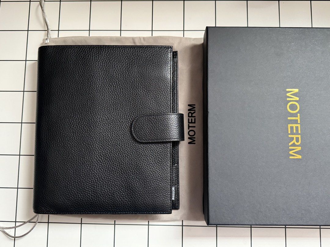 Moterm A5 Luxe Rings — (Category: Stationery & School Supplies) located in Pasig City. Submitted by mikanne_shops (Listing ID 1466648499, Image 1). Description: Almost new! No issues and in pristine condition. Complete with dust bag & box. Unused pockets, used not more than a month DM for more pics ☺️ ✨ freebies RFS: No time to use it anymore. 🥲 - Brand: Moterm - Material: Premium leather in black pebbled finish - Design: Structured ring binder 