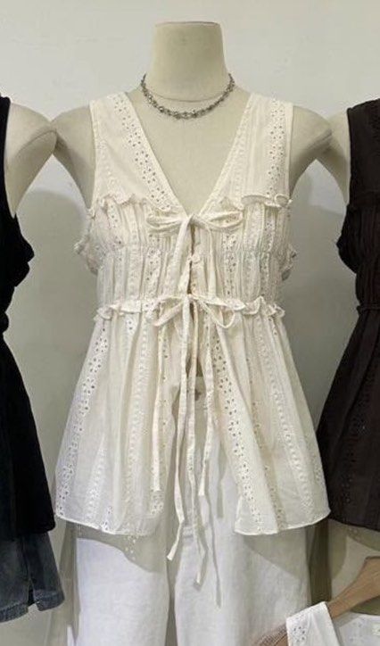 Mt. Matinee Basic Eyelet V-Neck Top (Category: Blouses) located in Pasig City. Submitted by louisers (Listing ID 1466745083, Image 2). Description: - Brand: Mt. Matinee Basic - Condition: Brand new with original tags attached - Style: Sleeveless V-neck with ribbon tie front, eyelet lace panels, and ruffles - Fabric: Light and airy, perfect for warm weather - Versatility: Easy to match with jeans or skirts SELLING THIS FOR THE SAME COST I GOT THIS