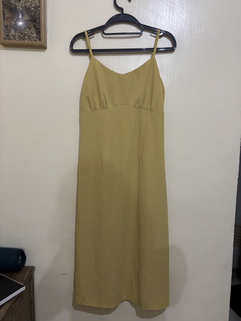 Mustard Yellow Spaghetti Strap Midi Dress (Category: Dresses) located in Balayan. Submitted by authenticfindsbymrb (Listing ID 1466702675, Image 1). Description: - Color: Vibrant mustard yellow - Style: Chic midi dress with thin, adjustable spaghetti straps - Neckline: V-neck with gathered bust detailing - Fit & Closure: Hidden back zipper and elastic panels on the upper back for extra stretch - Condition: Excellent, clean seams with no obvious f