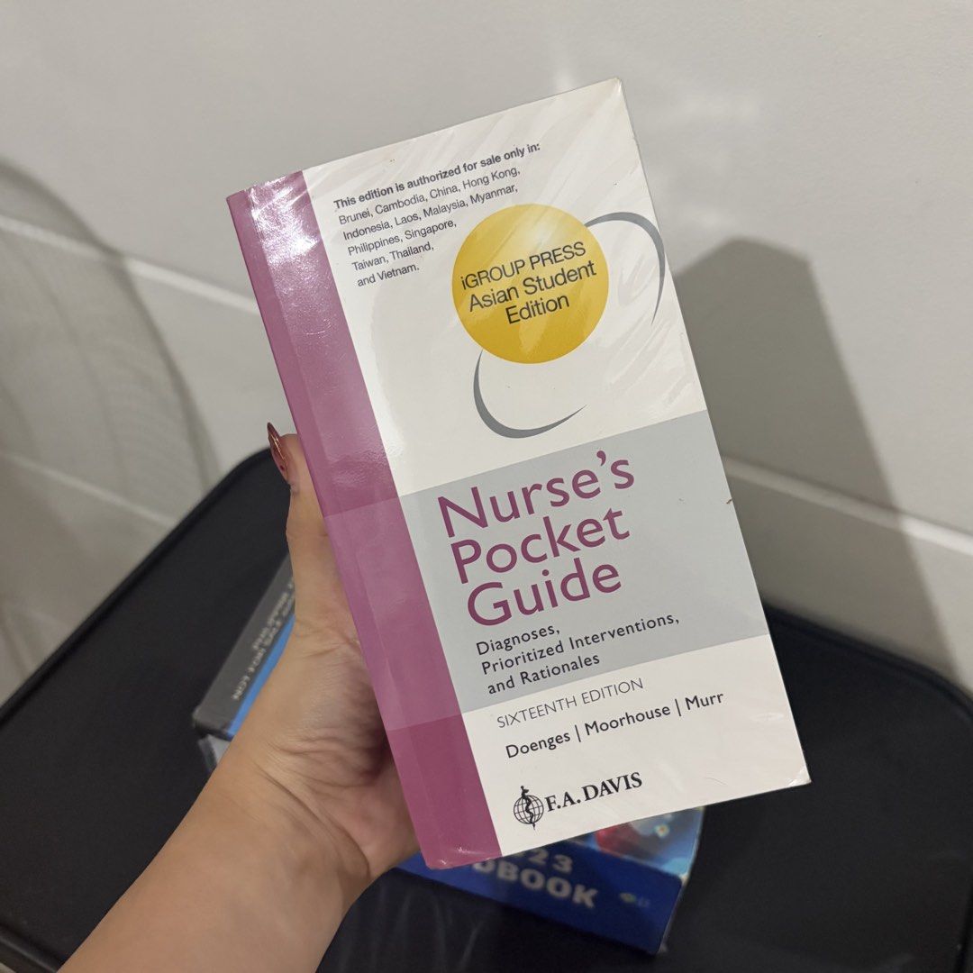 NANDA & 2023 Drug Handbook (Category: Textbooks) located in Lucena. Submitted by chelseaabelar (Listing ID 1466692721, Image 2). Description: - Bundle of 2 essential nursing reference books - Nursing 2023 Drug Handbook: comes with pre-attached colored index tabs for quick referencing - Nurse's Pocket Guide: 16th Edition, Asian Student Edition - Condition: Both books are nicely wrapped in clear protective plastic covers - Ideal for nursing student