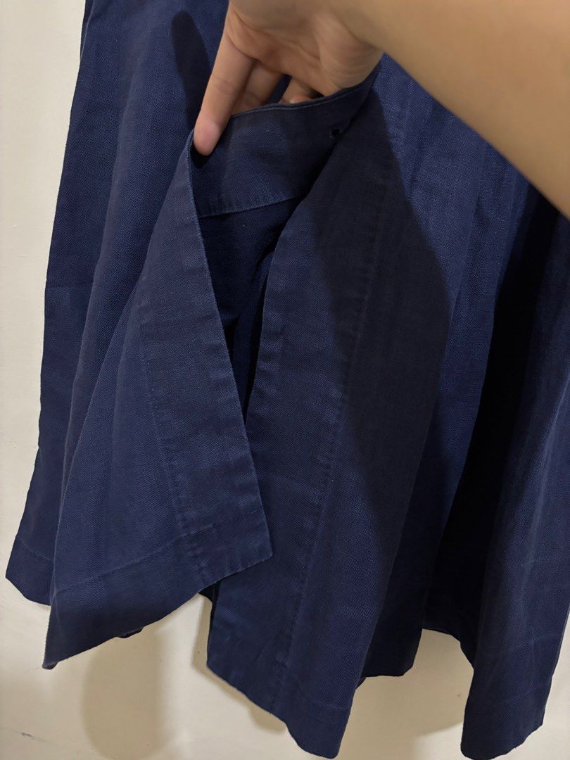 Navy Blue Linen Button-Front Midi Skirt Size XS (Category: Skirts) located in Balayan. Submitted by authenticfindsbymrb (Listing ID 1466705565, Image 3). Description: - Color: Dark blue - Material: Branded 100% breathable linen, machine washable - Size: FR 34, US XXS, EU XS, JP 5 (Waist measures roughly 13" flat) - Fit: High-waisted midi length with built-in belt loops - Details: Full button-down front with matching dark buttons, front pleats, an