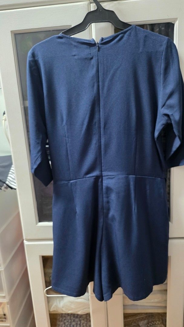 Navy Blue Wrap Style Dress with Side Ties (Category: Dresses) located in Manila. Submitted by m.is.happy (Listing ID 1466722535, Image 2). Description: - Color: Classic Navy Blue - Style: Wrap dress with flattering V-neckline - Sleeves: Three-quarter length - Fit: Adjustable tie closure at the right waist - Closure: Back zipper near the collar - Details: Smooth fabric and clean stitching throughout - Versatility: Great for both office wear and ca