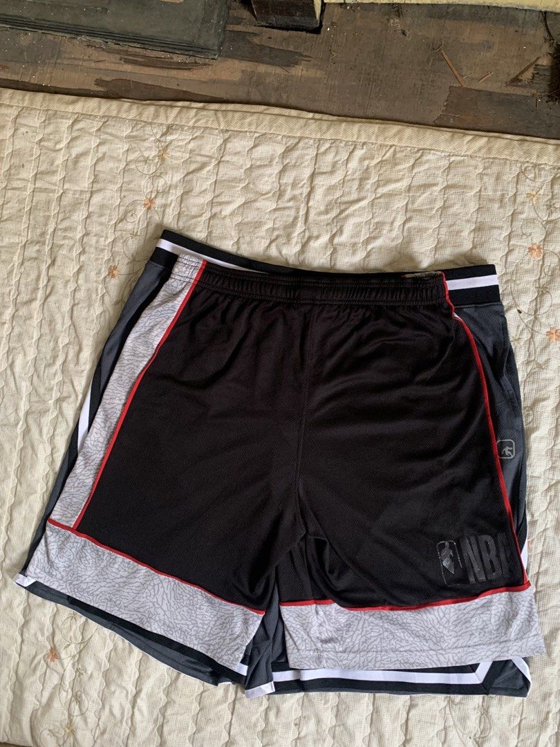 NBA Basketball Shorts Black Grey Large (Category: Shorts) located in Manila. Submitted by homeroabro81890 (Listing ID 1466587237, Image 2). Description: - Brand: NBA - Size: Large - Color: Black and grey with red piping accents - Design: Stylish elephant print on lower panels - Material: Lightweight, breathable mesh fabric made in Egypt - Features: Comfortable elastic waistband with adjustable drawstring - Condition: Perfect for workouts, basketb