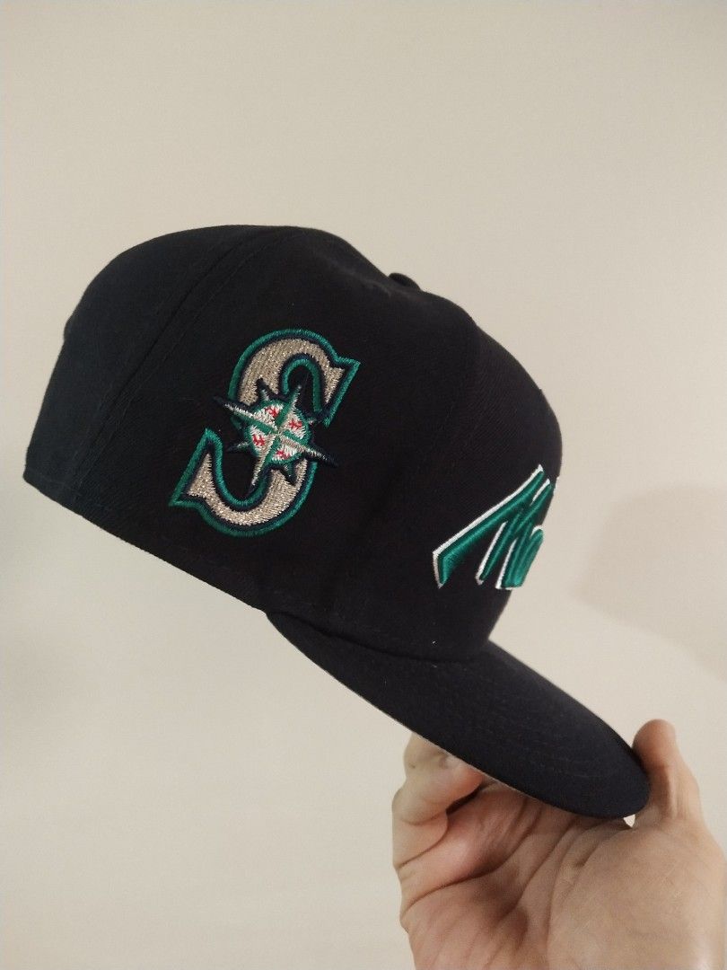 New Era 9FIFTY Seattle Mariners Snapback Hat Black (Category: Caps & Hats) located in Manila. Submitted by drud91296 (Listing ID 1466576576, Image 2). Description: - Brand: New Era 9FIFTY Snapback - Team: Seattle Mariners (front embroidery & side 'S' logo) - Color: Classic black crown with contrasting grey underbrim - Size: One size fits most (adjustable plastic strap closure) - Condition: Brand new with tags and clean interior taping - Perfect f