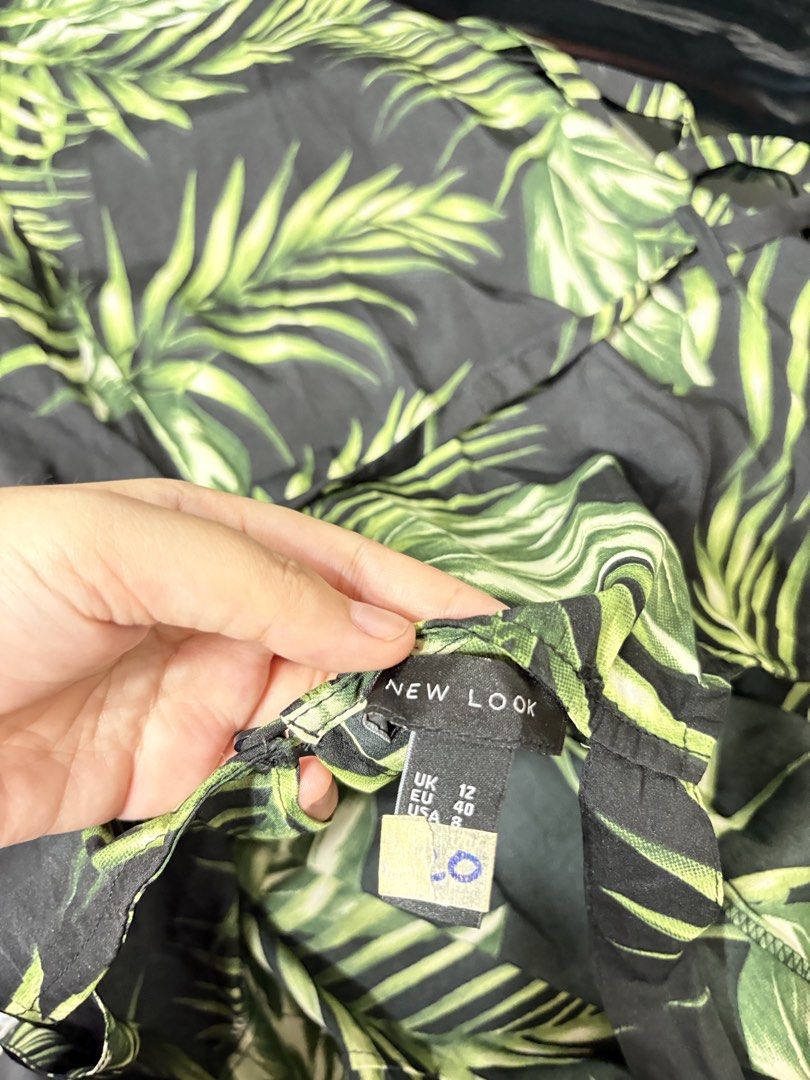 New Look Tropical Palm Print Romper (Category: Rompers) located in General Trias. Submitted by crissy9053136 (Listing ID 1466695965, Image 3). Description: - Brand: New Look - Style: Palm leaf print romper with square neckline and thick straps - Size: UK 12 / EU 40 / US 8 - Extras: Includes a matching waist tie belt for a flattering fit - Fabric: Light and breezy material, ideal for warm weather and vacation vibes - Condition: Excellent.