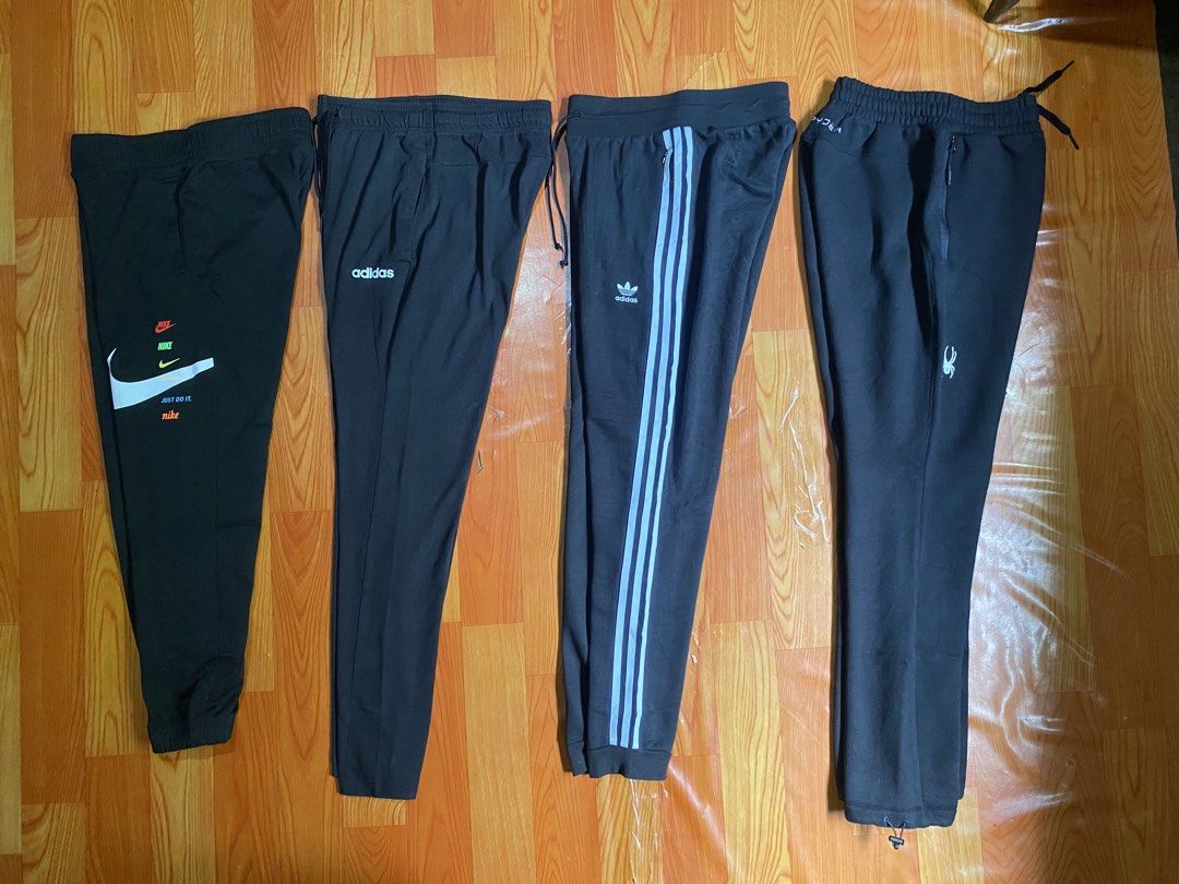 Nike, Adidas, and Spyder Black Sweatpants Bundle (Category: Joggers) located in Cebu City. Submitted by monflor (Listing ID 1466752716, Image 1). Description: 4 black sweatpants from top sporty brands - Includes Nike multi-logo jogger, Adidas text logo pants, Adidas three-stripe trefoil sweatpants, and Spyder zipper pocket pants with adjustable bungee hem - Features comfortable elastic waistbands across all pairs - Perfect for daily wear, workout