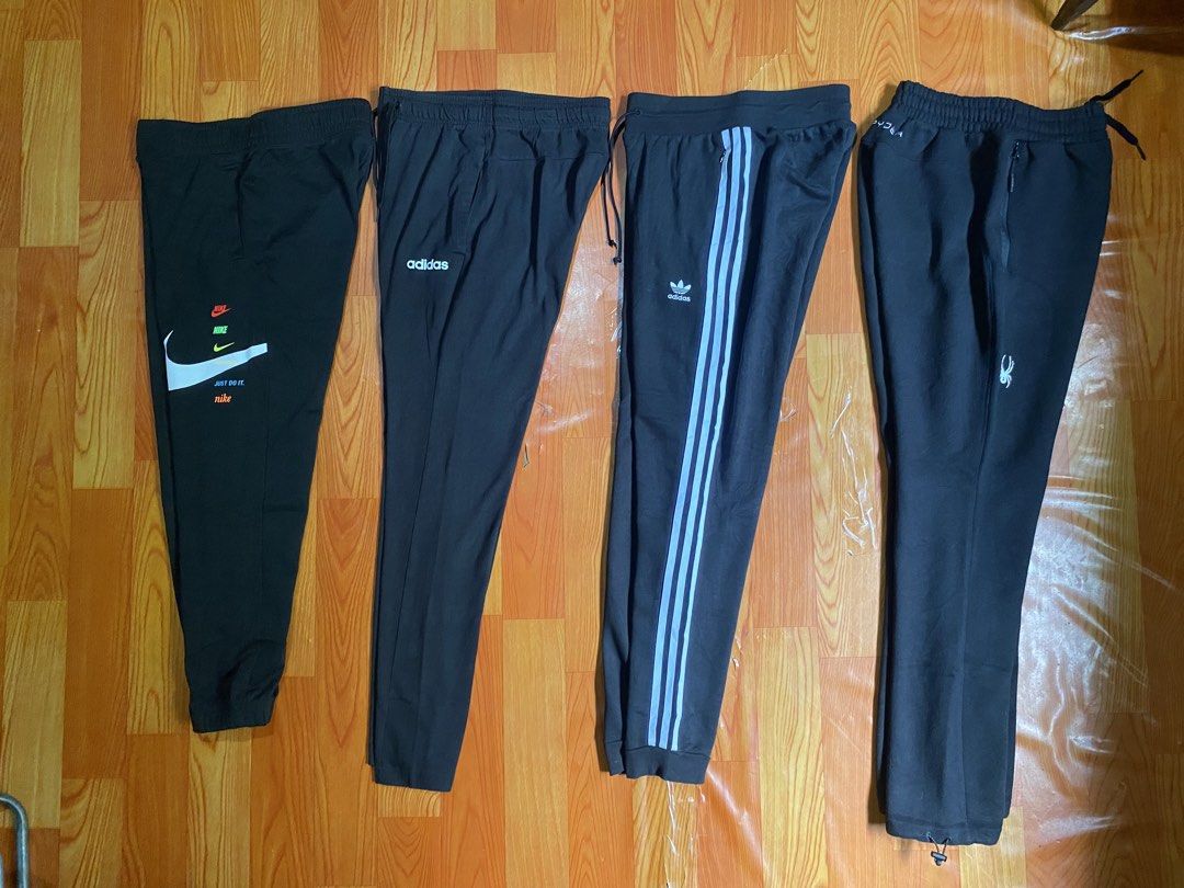 Nike, Adidas, and Spyder Black Sweatpants Bundle (Category: Joggers) located in Cebu City. Submitted by monflor (Listing ID 1466752716, Image 2). Description: 4 black sweatpants from top sporty brands - Includes Nike multi-logo jogger, Adidas text logo pants, Adidas three-stripe trefoil sweatpants, and Spyder zipper pocket pants with adjustable bungee hem - Features comfortable elastic waistbands across all pairs - Perfect for daily wear, workout