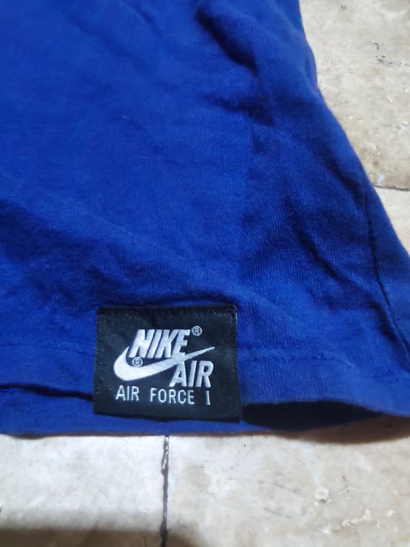Nike Air Force 1 Blue T-Shirt (Category: Tshirts & Polo Shirts ) located in Santa Rosa. Submitted by izxenjairr80094 (Listing ID 1466673136, Image 2). Description: - Brand: Nike Air Force 1 - Color: Royal Blue with bold white graphic print - Size: XL - Material: 100% Cotton (Made in China) - Details: Crew neck, short sleeves, and small Nike Air hem tag - Mode of Payment: GCash, BPI, or Bank Transfer - Shipping: Via J&T Express or Lalamove (Buyer 