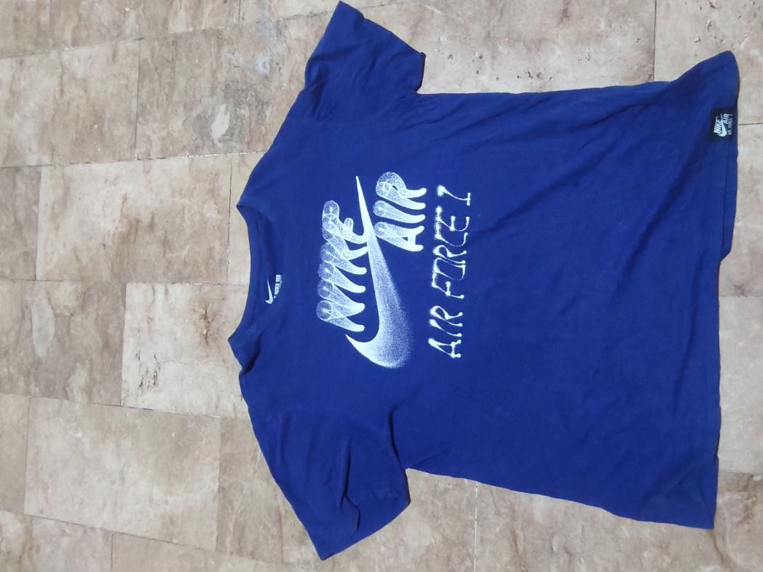 Nike Air Force 1 Blue T-Shirt (Category: Tshirts & Polo Shirts ) located in Santa Rosa. Submitted by izxenjairr80094 (Listing ID 1466673136, Image 1). Description: - Brand: Nike Air Force 1 - Color: Royal Blue with bold white graphic print - Size: XL - Material: 100% Cotton (Made in China) - Details: Crew neck, short sleeves, and small Nike Air hem tag - Mode of Payment: GCash, BPI, or Bank Transfer - Shipping: Via J&T Express or Lalamove (Buyer 