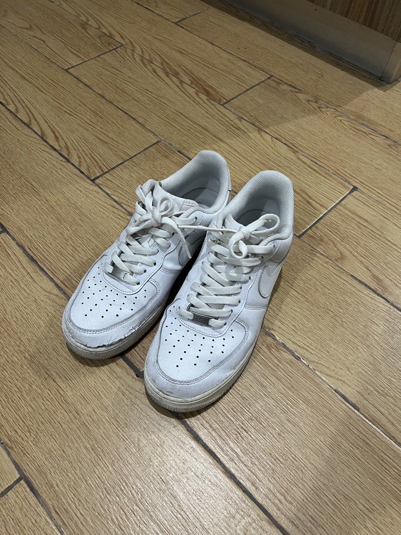 Nike Air Force 1 Triple White (Category: Sneakers) located in Manila. Submitted by tankalvin479038 (Listing ID 1466730254, Image 1). Description: - Brand: Nike Air Force 1 - Color: Triple White - Condition: Damaged, noticeable creasing and cracking on the toe box, regular wear and dirt marks present.