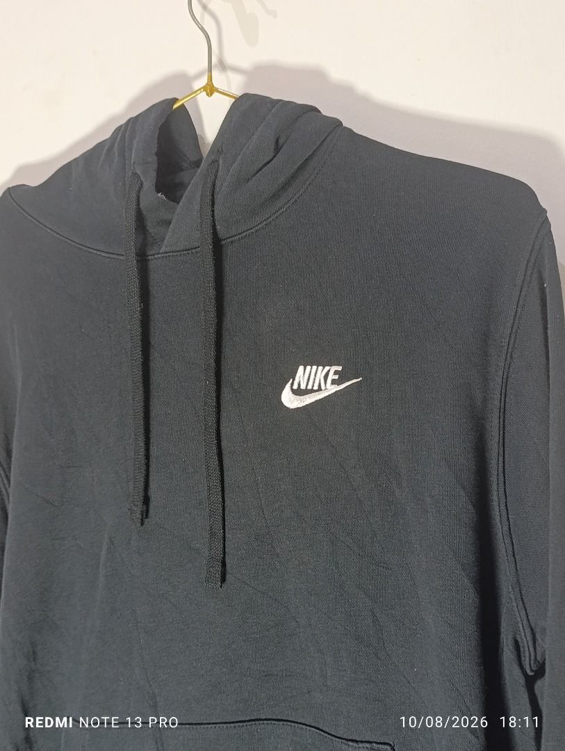 Nike Black Hoodie with Front Pocket and Drawstrings (Category: Hoodies) located in Pasig City. Submitted by firstpick_thrift (Listing ID 1466772241, Image 2). Description: - Brand: Nike - Color: Black with white embroidered logo - Style: Standard fit pullover hoodie - Features: Front pouch pocket, adjustable black drawstrings, ribbed cuffs and hem - Condition: Brand new / Excellent quality - Perfect for casual wear and daily styling.