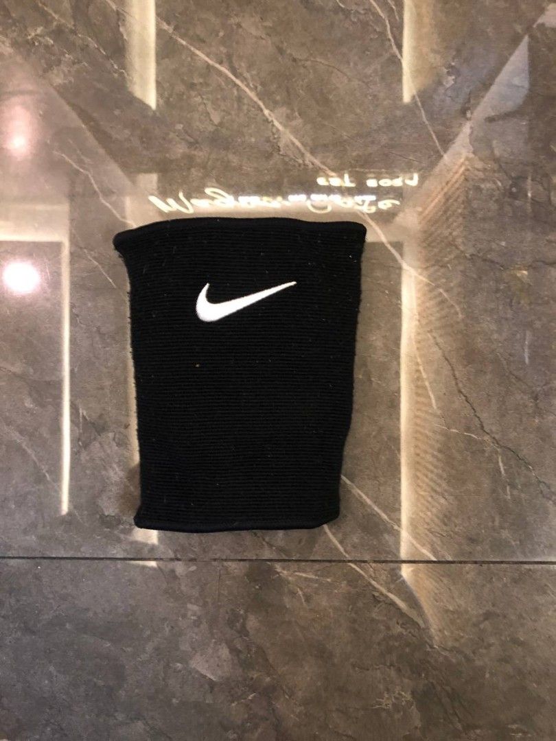 Nike Black Knee Pad with White Logo (Category: Shorts) located in Santa Cruz. Submitted by remsonnnc (Listing ID 1466625163, Image 1). Description: - Authentic Black Nike knee pad - Classic white embroidered swoosh logo on the front - Stretchy fabric sleeve style for a snug fit - Strong elastic stretch on the top opening to prevent slipping - Ideal for basketball, volleyball, and other contact sports - Condition: Normal wear from previous use, bu