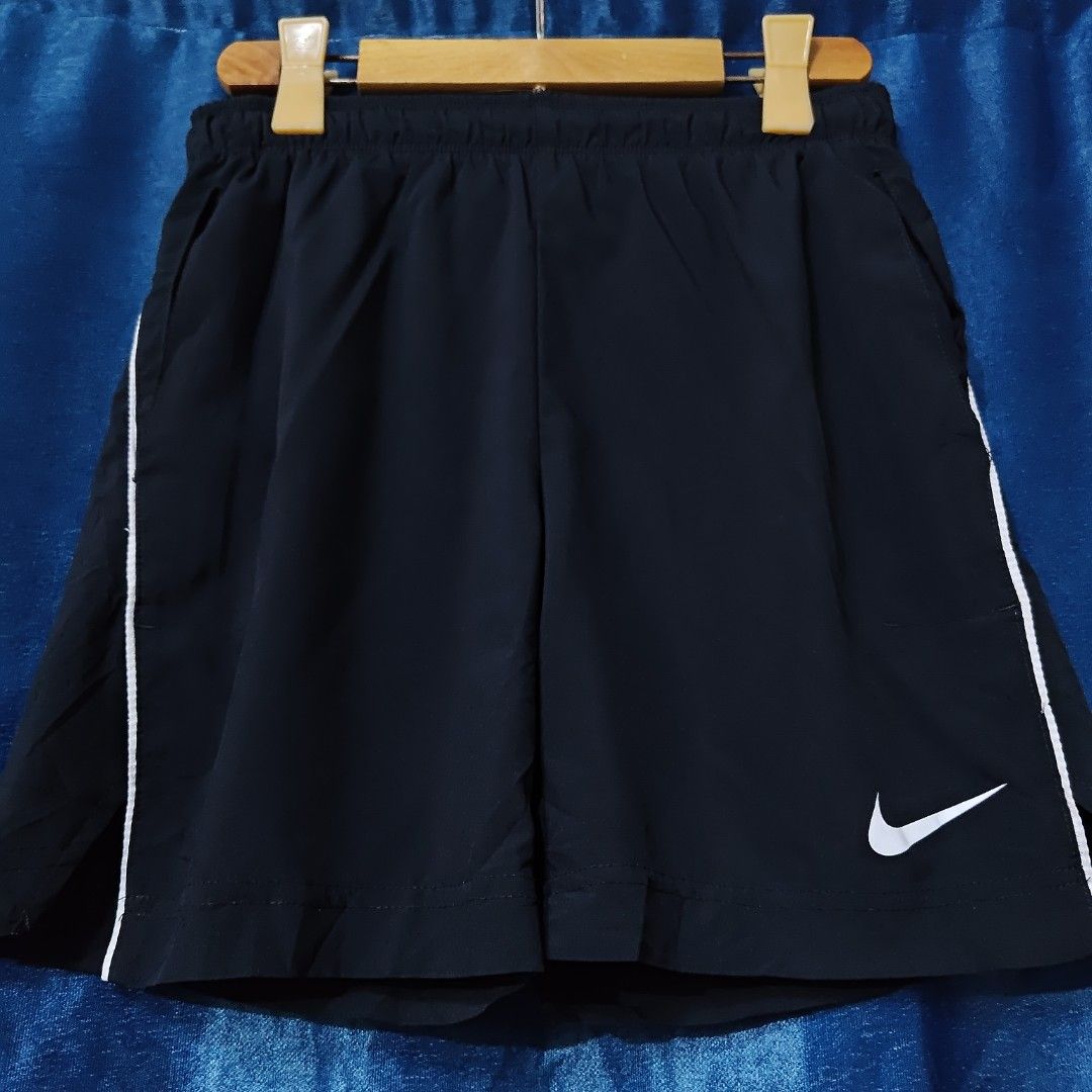 NIKE DRI FIT WOVEN SHORT (Category: Shorts) located in Makati City. Submitted by upcycled.closeth (Listing ID 1466580320, Image 2). Description: - Authentic Nike product - Black, Nylon short - Size: small to medium (men's) - Weistline: 29-32 - Length: 16 - Authentic - flaws: no flaws - Excellent condition - Need wash, fresh from bale - Features design of Nike woven short - Material: 100% nylon !!STILL NEGOTIABLE!!.
