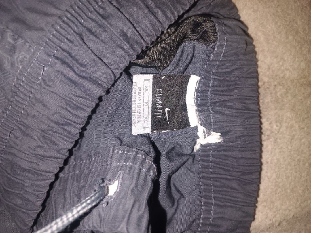 Nike Embroidered Track Pants (Category: Joggers) located in Manila. Submitted by rhoydyyy (Listing ID 1466649537, Image 3). Description: Size on Tag: XL Length: 40 Issue: non working yung zipper sa left leg(fixable), cut yung wash tag pwede meetup, pickup kung malapit jnt kapag malayo.