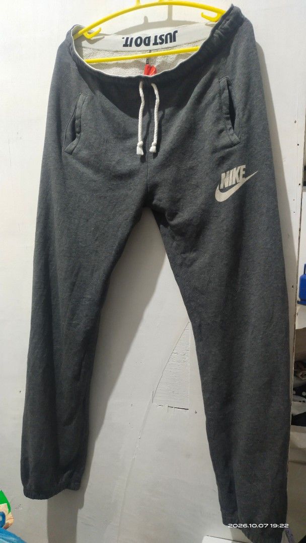 Nike Gray Sweatpants Size L (Category: Joggers) located in Manila. Submitted by rhobin.m08 (Listing ID 1466693236, Image 1). Description: - Brand: Nike - Item: Sweatpants - Color: Gray with white drawstring - Size: L (fits true to size) - Material: Comfortable cotton and polyester blend - Features: Side pockets, printed Nike logo on upper left leg - Origin: Made in China - Condition: Excellent / Ready to wear.