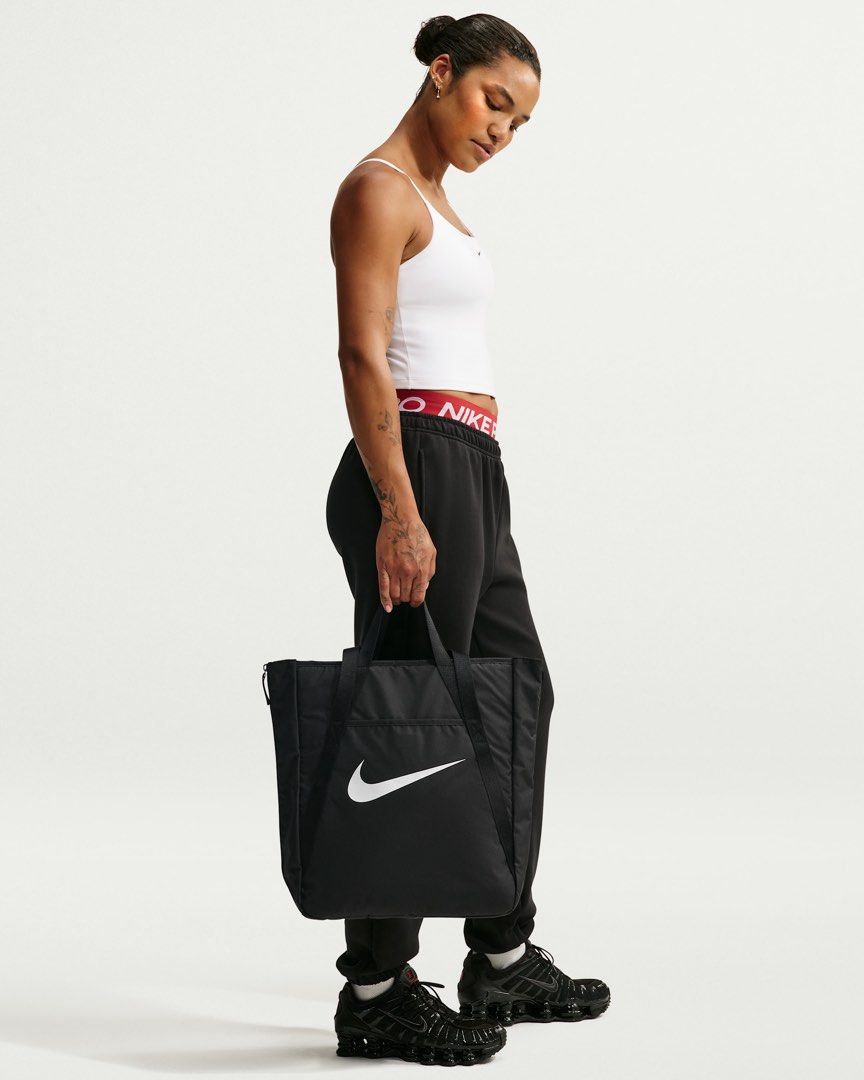 Nike Gym Tote bag (28L) (Category: Tote Bags) located in Quezon City. Submitted by mackoyusgoods (Listing ID 1466621344, Image 3). Description: No matter what your training journey is, this tote is made to handle it. Multiple deep pockets line the inside of this bag, both open and zipped for extra security. The front and back features pockets for the small things you want easy access to. And, the size of this tote is deceptive—the sides feature e