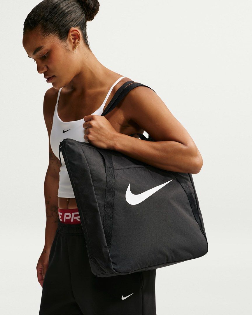 Nike Gym Tote bag (28L) (Category: Tote Bags) located in Quezon City. Submitted by mackoyusgoods (Listing ID 1466621344, Image 2). Description: No matter what your training journey is, this tote is made to handle it. Multiple deep pockets line the inside of this bag, both open and zipped for extra security. The front and back features pockets for the small things you want easy access to. And, the size of this tote is deceptive—the sides feature e
