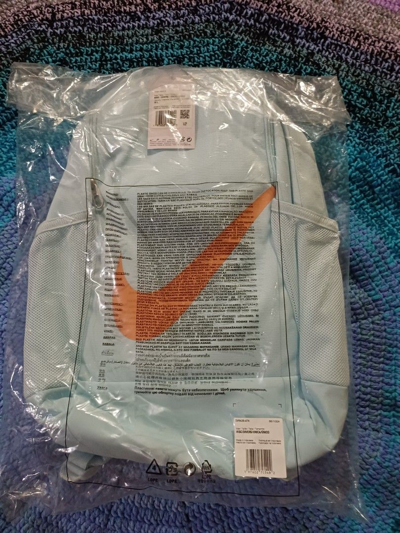 Nike Light blue backpack brand new in plastic wrapper (Category: Backpacks) located in San Pedro. Submitted by purpledream0316 (Listing ID 1466575885, Image 1). Description: - Color: Light blue with a clean solid design - Condition: Brand new, still sealed in original plastic packaging (unopened and untouched) - Comfort: Features padded shoulder straps and a stylish quilted back panel - Fulfillment: Ready to ship or available via Cash on Delivery