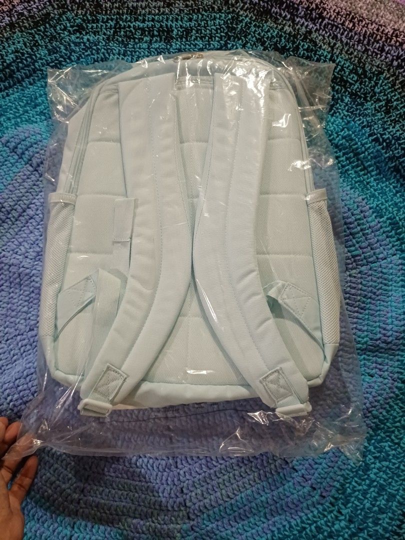 Nike Light blue backpack brand new in plastic wrapper (Category: Backpacks) located in San Pedro. Submitted by purpledream0316 (Listing ID 1466575885, Image 2). Description: - Color: Light blue with a clean solid design - Condition: Brand new, still sealed in original plastic packaging (unopened and untouched) - Comfort: Features padded shoulder straps and a stylish quilted back panel - Fulfillment: Ready to ship or available via Cash on Delivery
