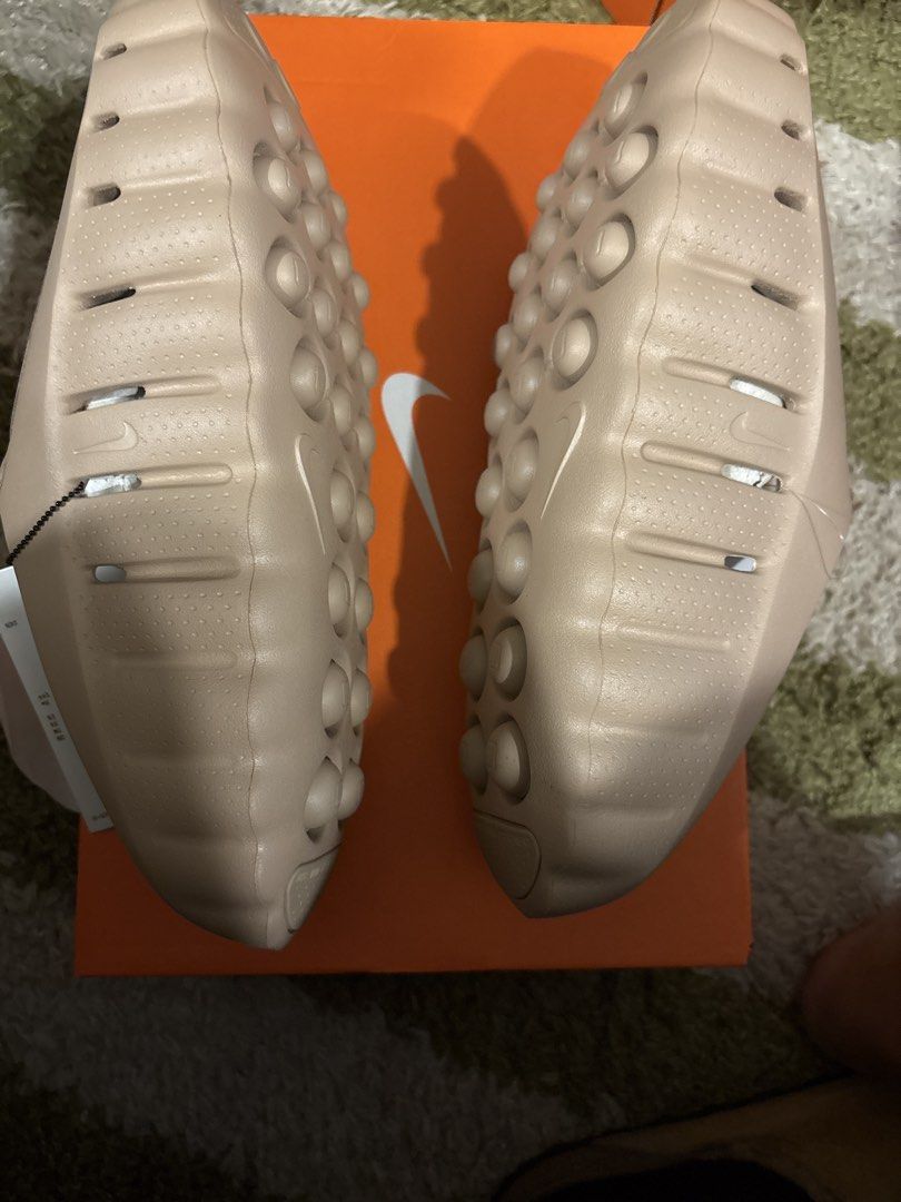 Nike Mind 001 (Category: Slippers & Slides) located in Pasig City. Submitted by ripescobar (Listing ID 1466688675, Image 2). Description: - Brand: Nike - Model: Nike Mind 001 Slides - Color: Tan Beige - Size: Men's US 10 - Condition: Brand new with original tags attached - Packaging: Includes original orange Nike box - Features: Chunky foam slip-on design, textured footbed, and perforated toe box.