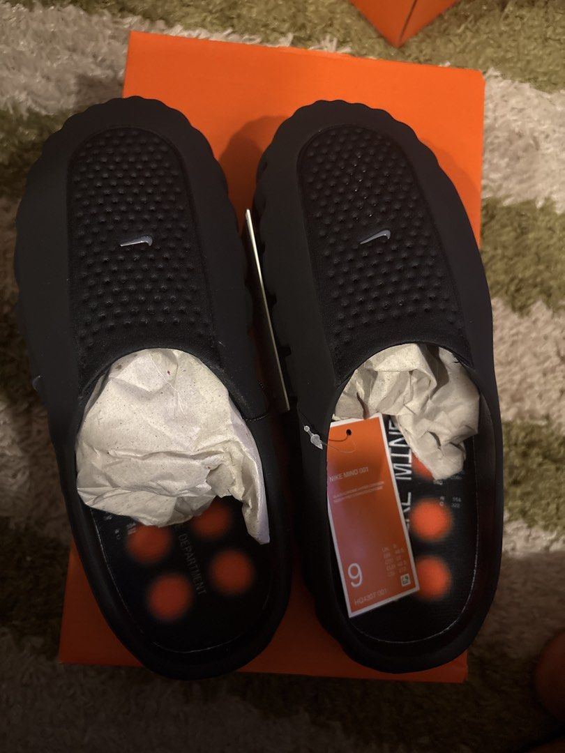 Nike Mind 001 Black Size 9 (Category: Sneakers) located in Pasig City. Submitted by ripescobar (Listing ID 1466687913, Image 1). Description: - Model: Nike Mind 001 Mules - Colorway: Black with striking orange accents - Size: Men's US 9 / Ready to wear - Design: Slip-on mule with breathable perforated uppers and unique studded outsole detailing - Condition: Brand new with original orange Nike box, tissue paper stuffing, and attached store tags.
