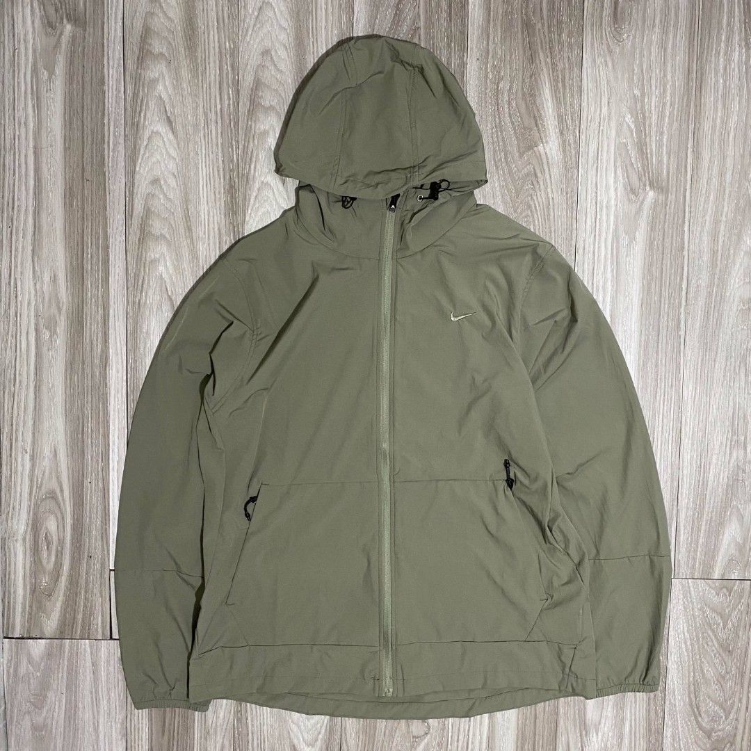 Nike Repel Windbreaker Jacket (Category: Coats, Jackets and Outerwear) located in Manila. Submitted by mad.tofu (Listing ID 1466769260, Image 3). Description: - Brand New with hangtag - Colors: Available in light yellow and olive green - Closure: Full zip with adjustable drawstrings on the hood - Storage: Two secure side zippered pockets - Fit & Comfort: Lightweight material with elastic cuffs on long sleeves - Versatility: Ideal for workouts or 