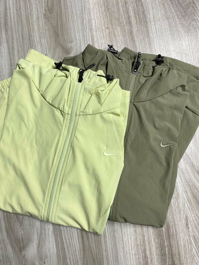 Nike Repel Windbreaker Jacket (Category: Coats, Jackets and Outerwear) located in Manila. Submitted by mad.tofu (Listing ID 1466769260, Image 1). Description: - Brand New with hangtag - Colors: Available in light yellow and olive green - Closure: Full zip with adjustable drawstrings on the hood - Storage: Two secure side zippered pockets - Fit & Comfort: Lightweight material with elastic cuffs on long sleeves - Versatility: Ideal for workouts or 