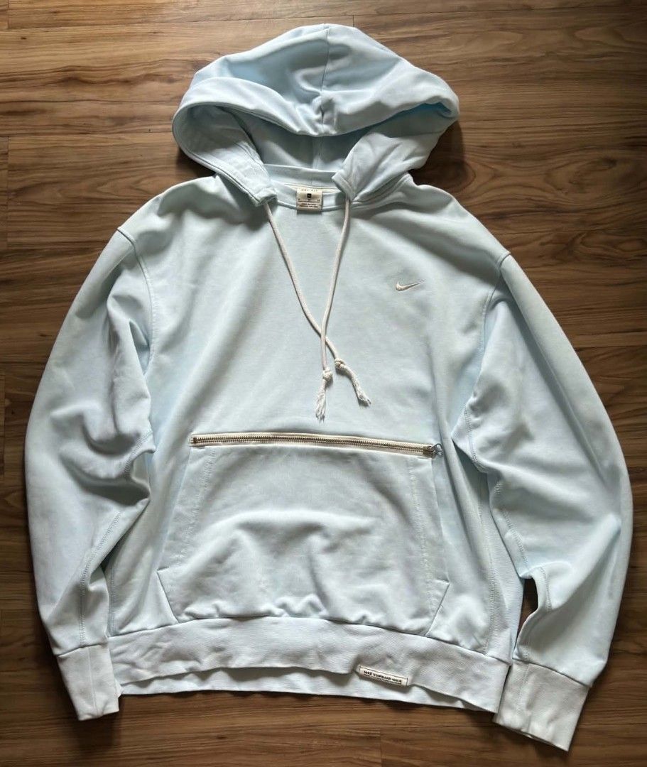 Nike Standard Issue Light Blue Hoodie (Category: Hoodies) located in Caloocan City. Submitted by jpygoodies (Listing ID 1466741192, Image 1). Description: - Brand: Nike (Standard Issue line) - Color: Light blue - Size: Small - Material: Performance Dri-FIT fabric - Design: Embroidered mini swoosh on chest - Storage: Front pouch pocket with hidden zip compartment - Details: Drawstring hood with knotted ends, ribbed cuffs and hem with woven label -