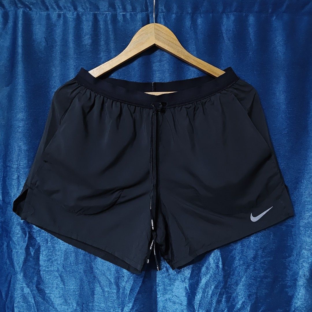 NIKE STRIDE RUNNING NYLON SHORT (Category: Shorts) located in Makati City. Submitted by upcycled.closeth (Listing ID 1466579709, Image 1). Description: - Authentic Nike running product - Black, nylon short - Size: Medium (men's) - Weistline: 29 to 32 - Length: 13 - Authentic - flaws: no flaws - Good condition - Need wash, fresh from bale - Features design of Nike running nylon short - Material: 100% nylon !!STILL NEGOTIABLE!!.