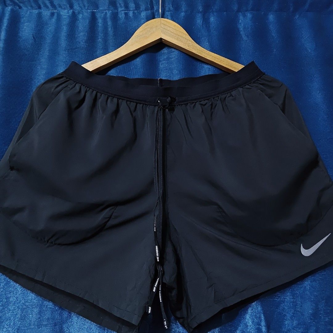 NIKE STRIDE RUNNING NYLON SHORT (Category: Shorts) located in Makati City. Submitted by upcycled.closeth (Listing ID 1466579709, Image 2). Description: - Authentic Nike running product - Black, nylon short - Size: Medium (men's) - Weistline: 29 to 32 - Length: 13 - Authentic - flaws: no flaws - Good condition - Need wash, fresh from bale - Features design of Nike running nylon short - Material: 100% nylon !!STILL NEGOTIABLE!!.