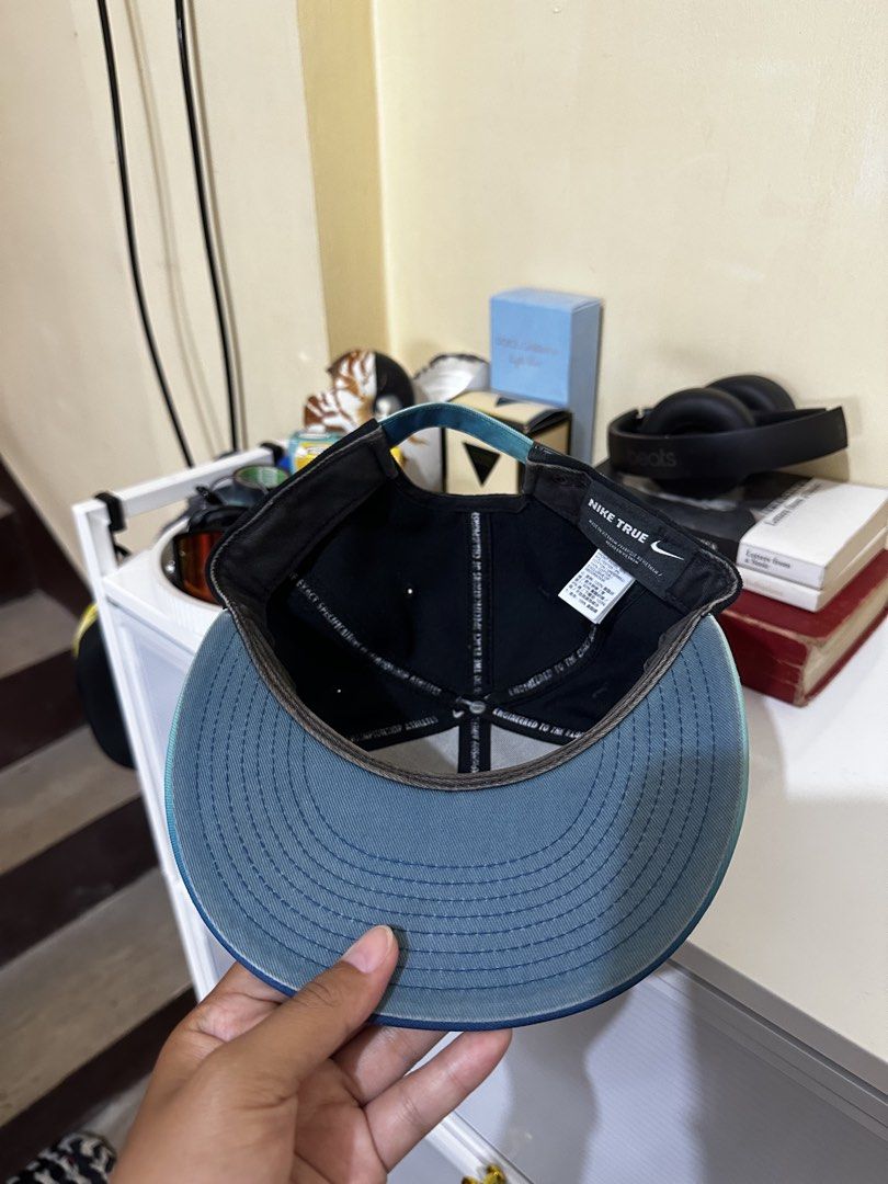 Nike True Snapback Cap Black Teal Gradient (Category: Caps & Hats) located in Baler. Submitted by sidequester (Listing ID 1466569945, Image 3). Description: - Brand: Nike True - Style: Snapback cap - Color: Black with teal gradient brim - Logo: Embroidered teal and silver iridescent Nike logo on front - Closure: Adjustable strap with metal clasp - MOP: Any online bank or e-wallets - MOD: Can do meet up and ship nationwide - Can offer discount or 