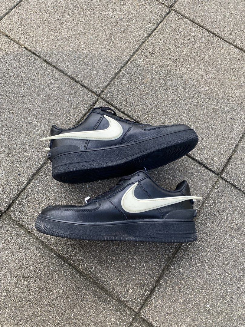 Nike x Ambush Air Force 1 Low Black White (Category: Sneakers) located in Davao. Submitted by thirdy.pfp (Listing ID 1466654424, Image 2). Description: Nike Af1 x Ambush 5.5 us / 23 cm Excellent 9/10 *washable dirts -1200 Nike Air Force 1 Low collaboration with Ambush. Black leather upper with exaggerated white Swoosh extending past the heel. AMBUSH branding on the heel bumper and tongue tag. AF1 lace dubraes attached. Soles show minimal wear. Cl