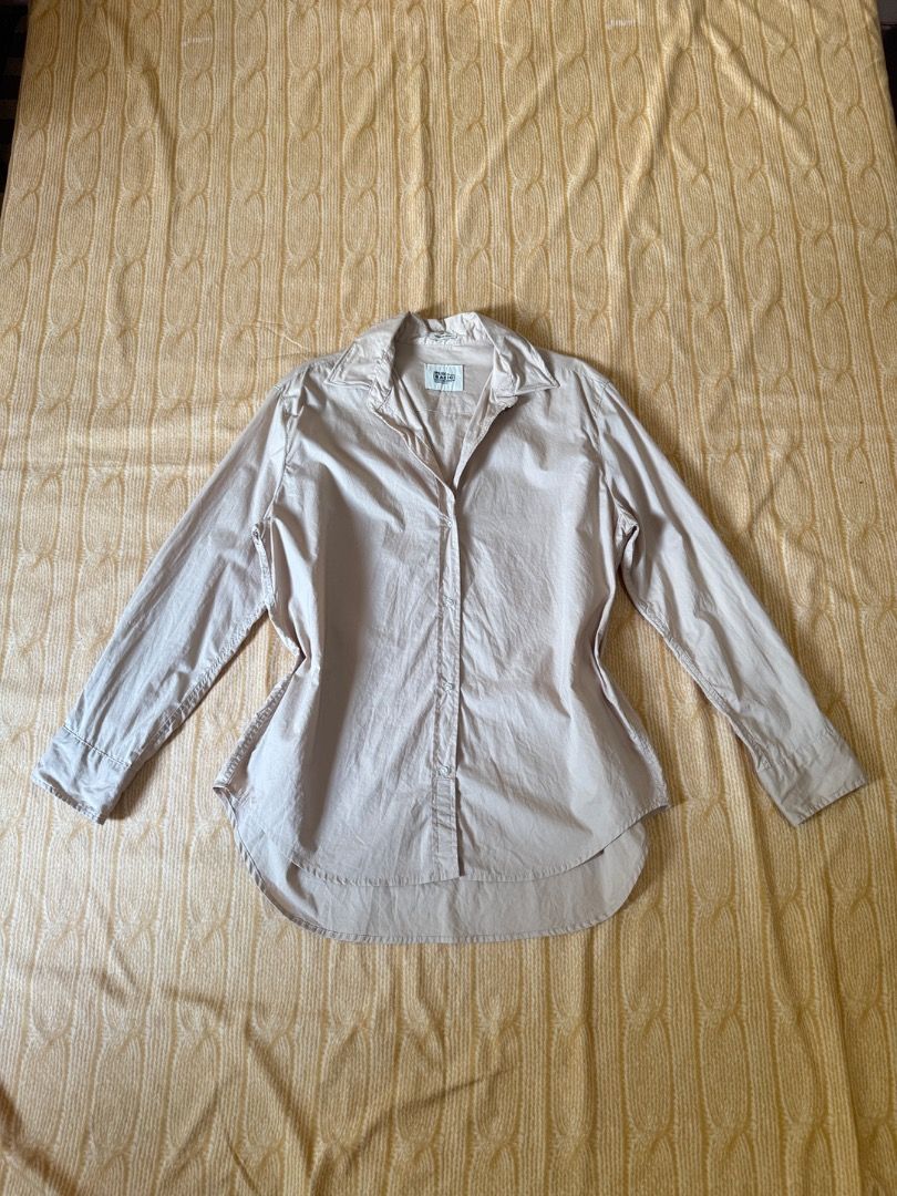 Niko and... Basic Button-Down Shirt Size 4 Nude Beige (Category: Shirts) located in Calasiao. Submitted by clothesbykim (Listing ID 1466744690, Image 1). Description: - Brand: Niko and... - Style: Basic button-down shirt - Color: Nude beige - Size: 4 - Details: Long sleeves, classic collar, curved hemline, front button closure - Fabric: Smooth and lightweight - Condition: Great pre-loved condition - Perfect for: Office attire, daily wear, or casu
