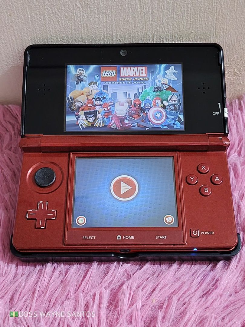 Nintendo 3DS Metallic Red Bundle with LEGO Marvel Game (Category: Nintendo) located in Marikina City. Submitted by waynewayne2 (Listing ID 1466568343, Image 2). Description: FOR SALE OR TRADE +cash Pampanga meetup Jnt, lbc or lalamove sa malayo 09760568942 OG. NINTENDO 3DS -Very presentable unit -Complete w/its original Stylus, 2gb sd card, charger 110v i provide usb cable for 220v -w/1 free games Lego marvel PHP 4999 Only! Issue is, Rubber sa an