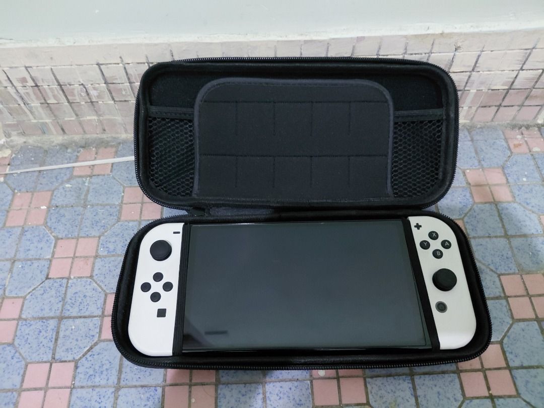 Nintendo Switch OLED 白色主機連保護袋 （分類：Nintendo 任天堂）位於 Hong Kong。 由 coolocean_7ef81e 提交（商品編號 1466697734，圖片 1）。簡介： 有鬼滅卡。